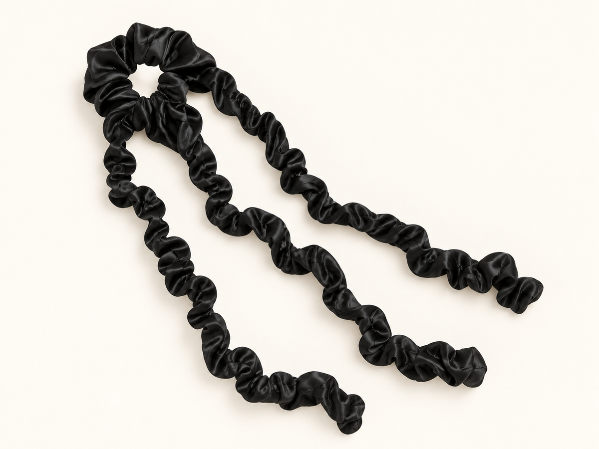 Black one-piece heatless curling band with three attached fabric lengths